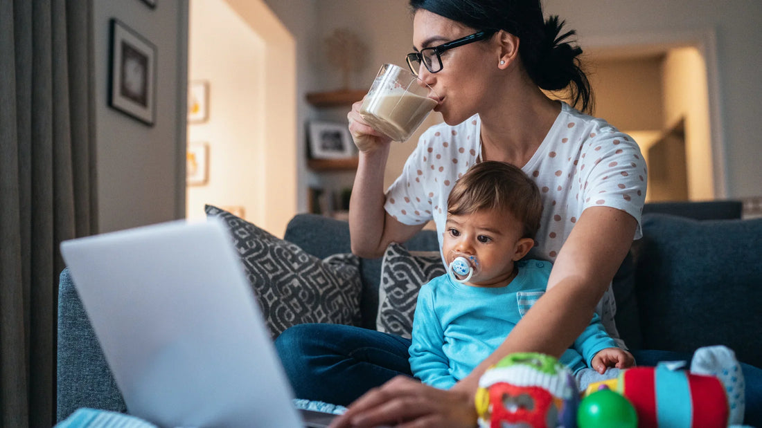 Busy mom with baby drinking cordyceps cacao drink