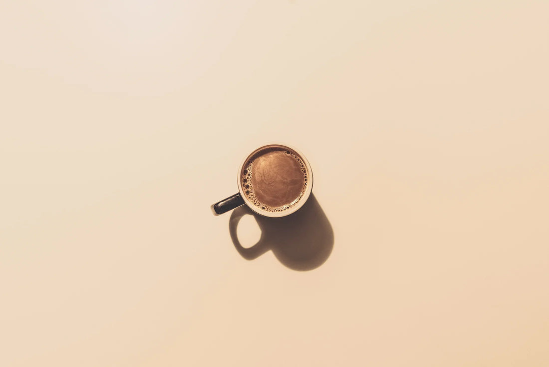 Cup of Cacao on beige background