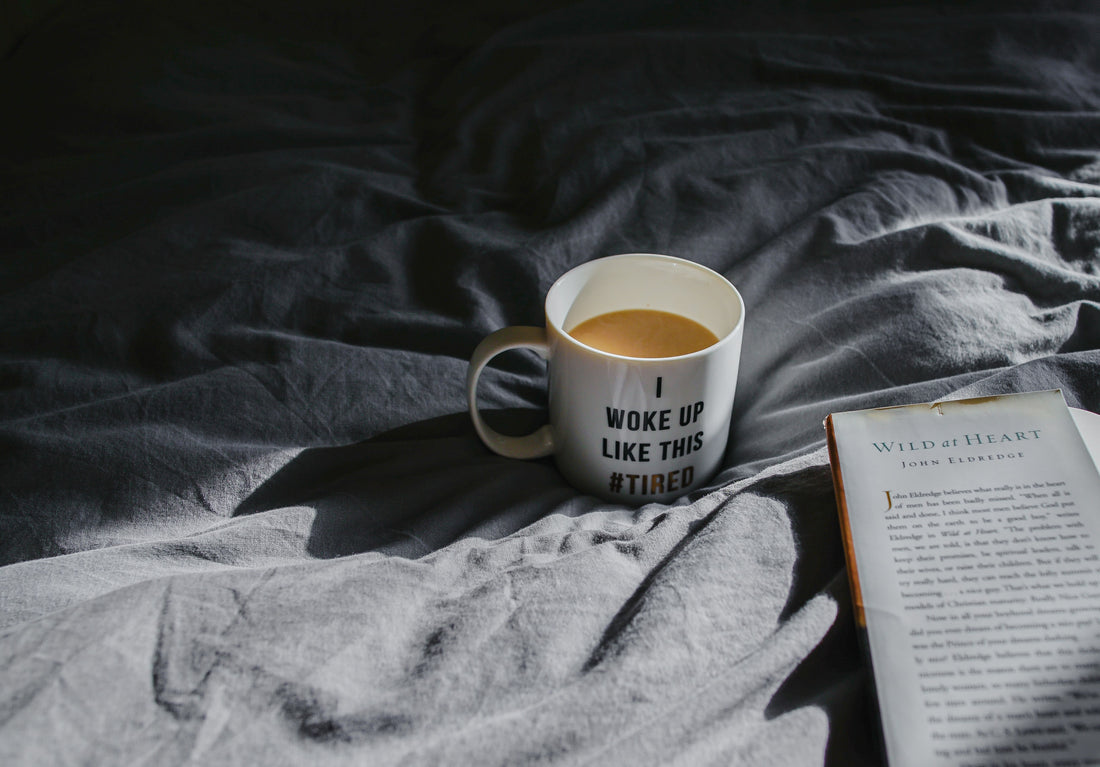 Why Am I Tired All the Time, Mug on a bed with a book